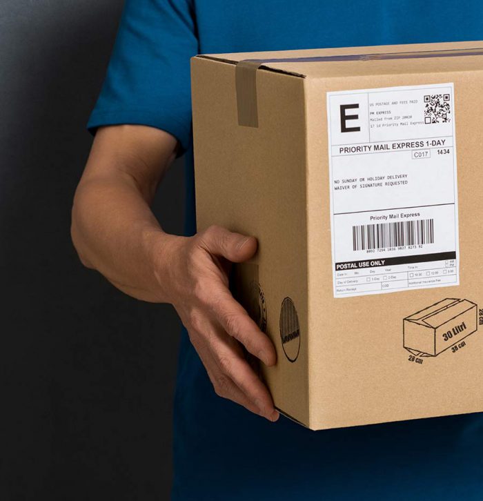 Man holding box with shipping label